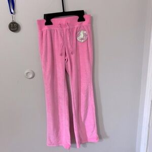 A basic editions pink sweats with flare at the bottom fit for 7/8 year old girls